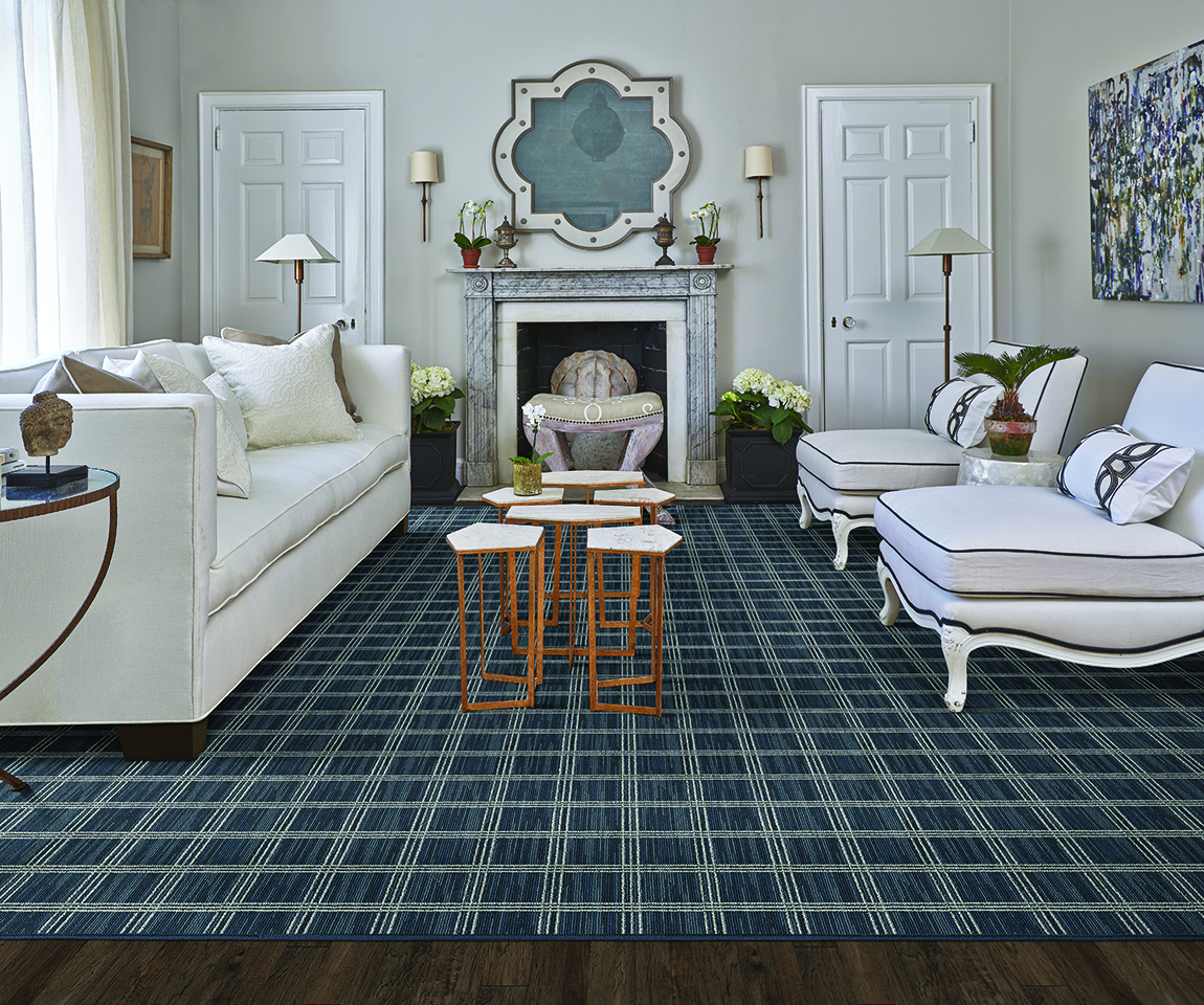 Living room utilizing a 2020 neutral color theme that incorporates off-white painted walls with a white couch and chairs.